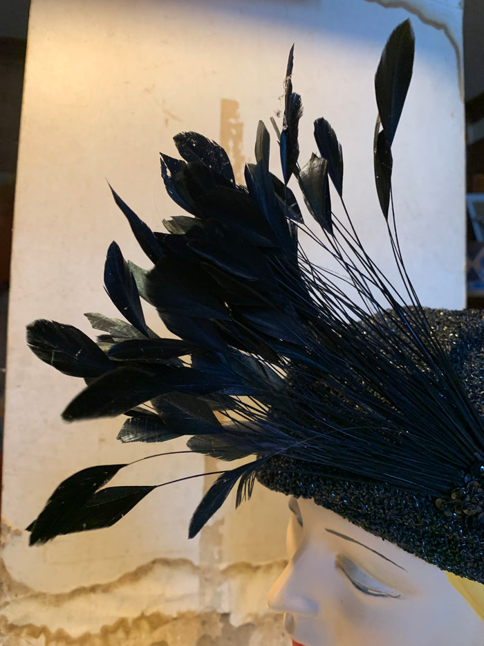 Black Bird Reimagined Metallic Turban Style Hat with Antique Feather and Sequin Accent