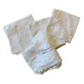 Set of white embroidered napkins on a white background